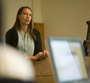 woman standing in front of classroom